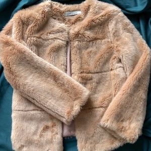 Woman beige faux fur jacket